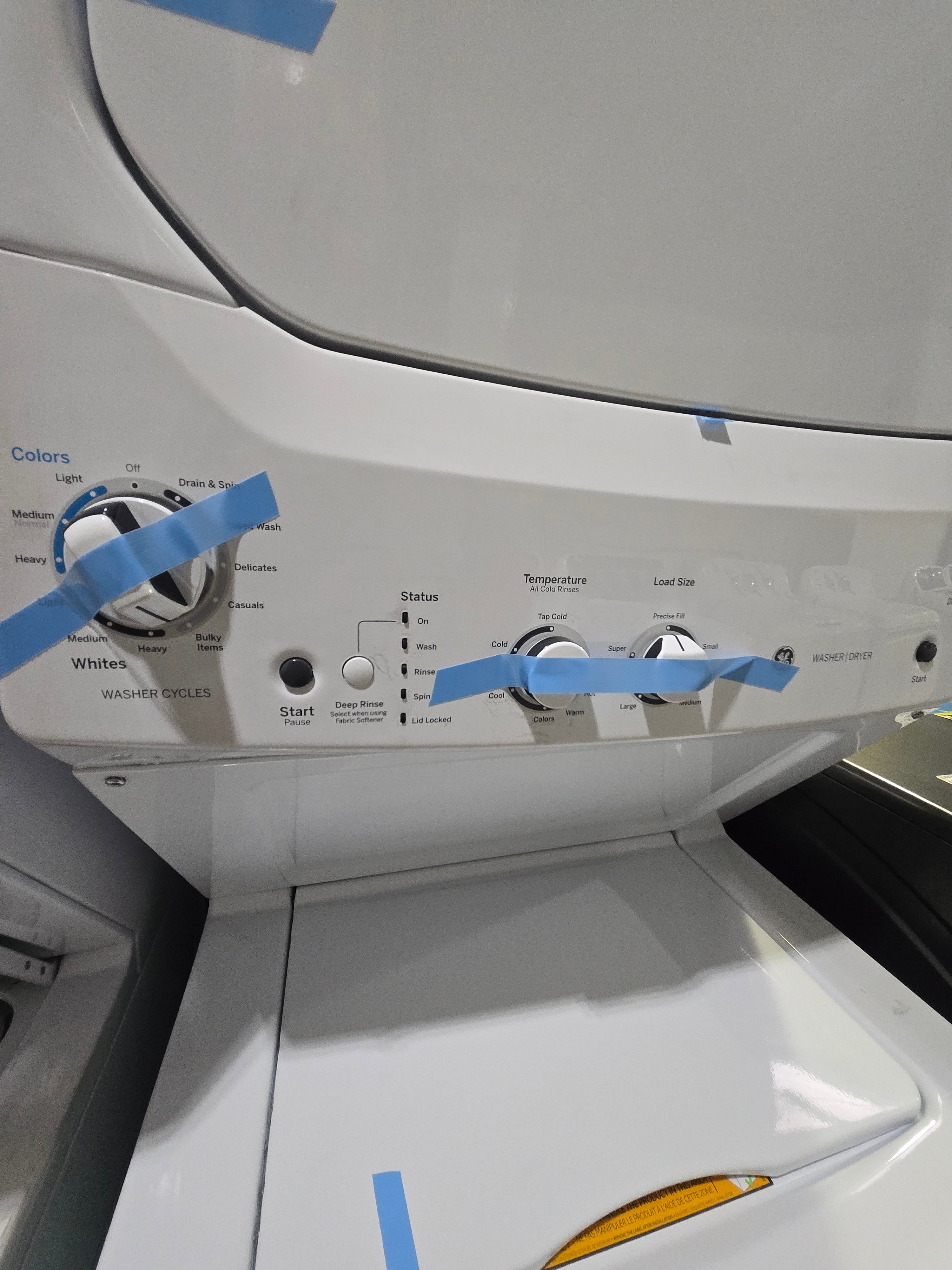 GE Gas Stacked Laundry Center with 3.8-cu ft Top load Washer and 5.9-cu ft Dryer White Model# GUD27GSSMWW
