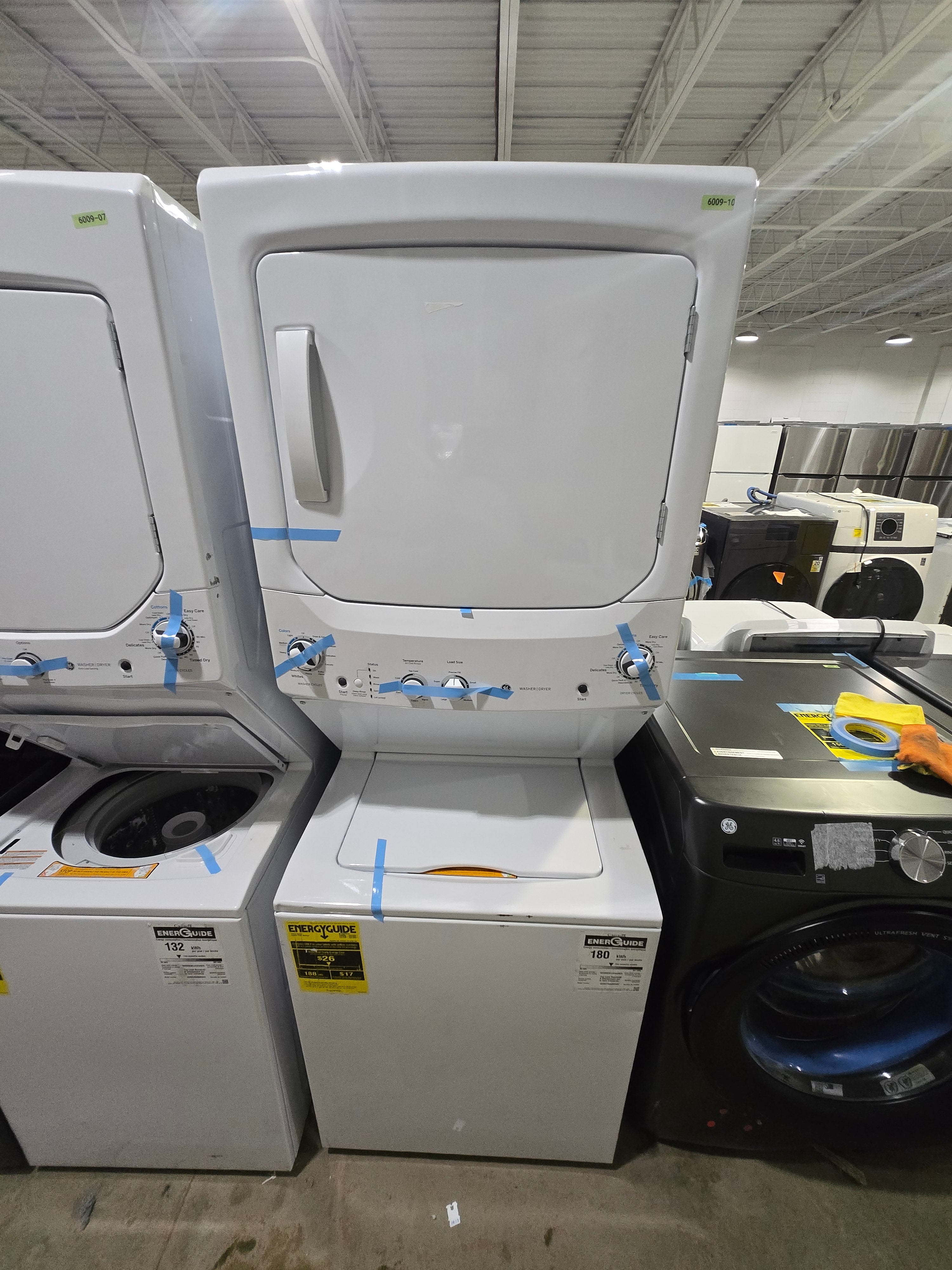 GE Gas Stacked Laundry Center with 3.8-cu ft Top load Washer and 5.9-cu ft Dryer White Model# GUD27GSSMWW